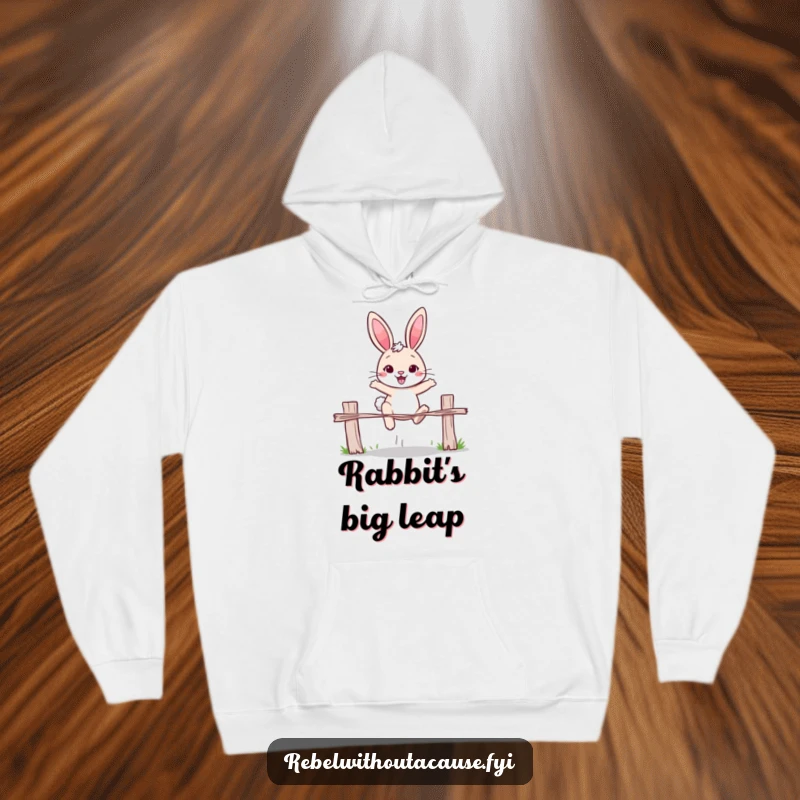 Funny rabbit hoodie featuring a cheerful rabbit with a determined expression, jumping over a broken fence. Cozy and motivational.