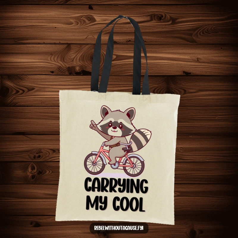 Funny kawaii raccoon giving a cheeky salute, riding a tiny bicycle backwards on a tote bag.